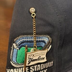 New Era Black Cap with White and Blue Embroidery